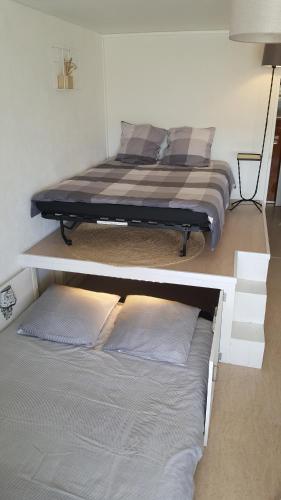 Posteľ alebo postele v izbe v ubytovaní Appartement rénové avec vue