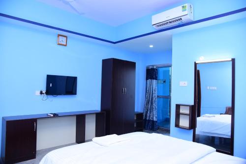 Posteľ alebo postele v izbe v ubytovaní Thangam Residency