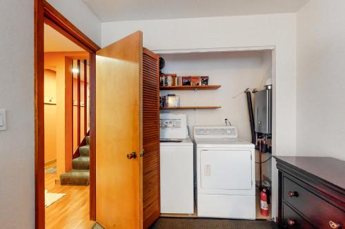 a kitchen with a refrigerator and a washer and dryer at Compton's in Girdwood