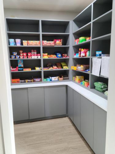 a walk in pantry with black shelves at Comfort Inn & Suites in Shelbyville