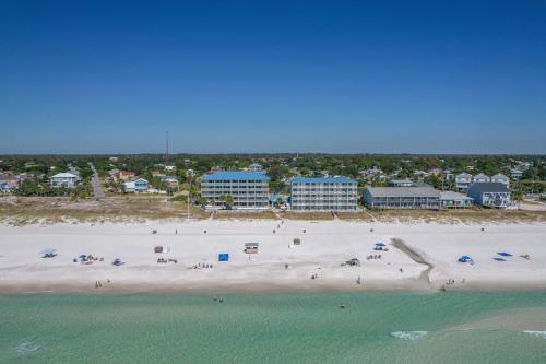 an aerial view of a beach with people and the ocean at Sugar Sands Beachfront Hotel, a By The Sea Resort in Panama City Beach