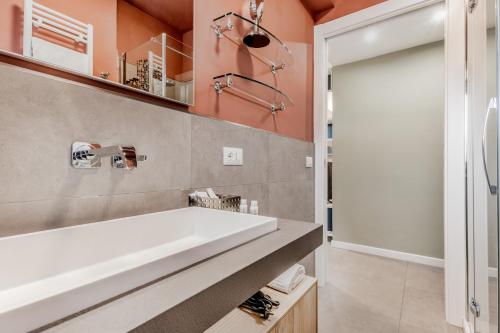 a bathroom with a white tub and a shower at Casa Pepe in Rome