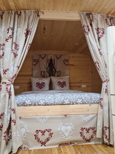 a bedroom with a bed with a canopy at Les roulottes a Sandie in Thionville