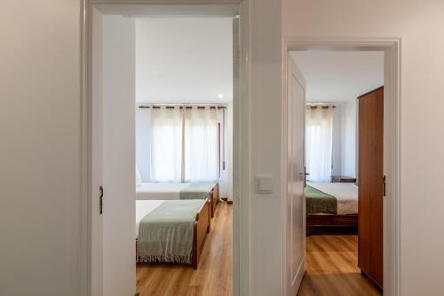 Posteľ alebo postele v izbe v ubytovaní Penthouse Praia de Olinda - Minho's Guest