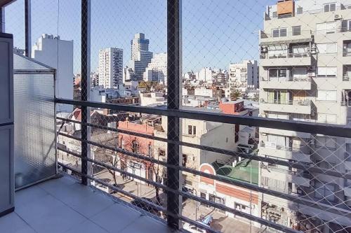 a balcony with a view of a city at AT803 - Monoambiente Luminoso en Colegiales in Buenos Aires