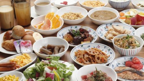 a table topped with bowls of different types of food at Richmond Hotel Asakusa in Tokyo