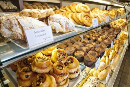 a bakery filled with lots of different types of pastries at Cozy Nordic Utopia, Bsmt Suite near WEM & DT, King Bed, WiFi in Edmonton