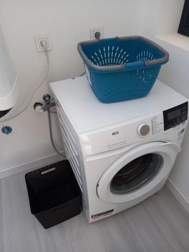 a washing machine with a basket on top of it at Luxury aparment in casilla de costa with Jacuzzi- Follow the sun in La Oliva