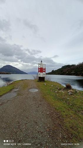 a house on the shore of a body of water at Casa de campo Llifén Futrono Lago Ranco in Ranco