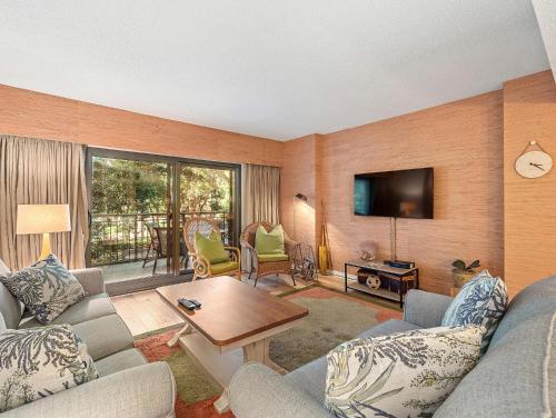 a living room with a couch and a table at Ocean One 222 in Hilton Head Island