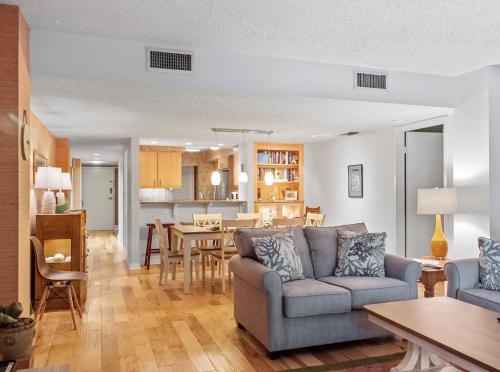 a living room with a couch and a dining room at Ocean One 222 in Hilton Head Island