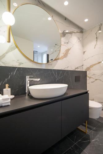 a bathroom with a sink and a mirror at Luxury Apartment Contesa in Rovinj