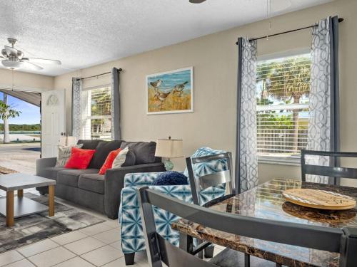 a living room with a couch and a table at Townhouse Apartment b in Fort Pierce