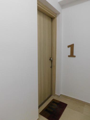 a hallway with a door with the number on it at Brand New Studio 1 in Komotini