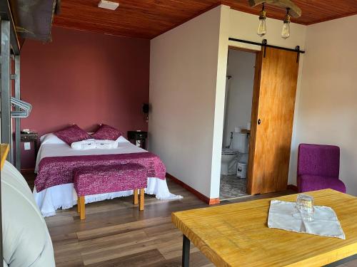 Ένα ή περισσότερα κρεβάτια σε δωμάτιο στο La Posada del Minero