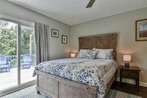 a bedroom with a bed and a balcony at 6 miles to downtown Asheville. Sleeps 5. in Asheville