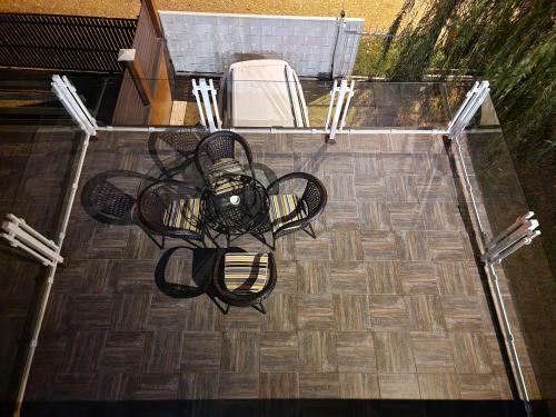 an overhead view of a table and chairs on a patio at Vila Odiseas in Belgrade