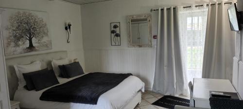 Ein Bett oder Betten in einem Zimmer der Unterkunft Lamaisonxv