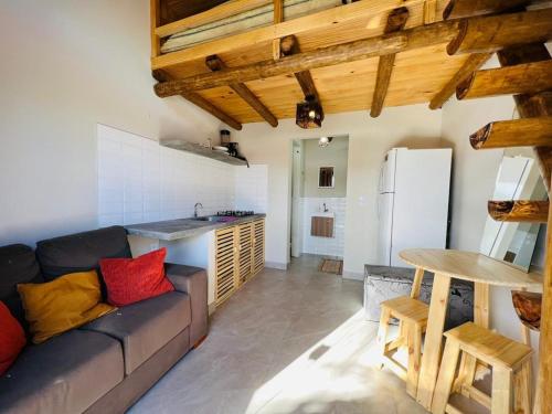 a living room with a couch and a table at Recanto do Mar in Pipa