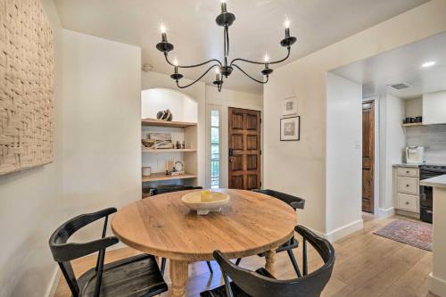 a dining room with a wooden table and chairs at Scottsdale Condo with Pool Access, Near Old Town! in Scottsdale
