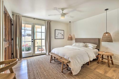 a white bedroom with a bed and a window at Scottsdale Condo with Pool Access, Near Old Town! in Scottsdale
