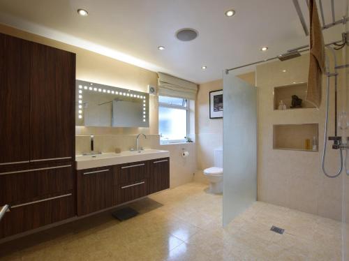 a bathroom with a sink and a toilet and a shower at Solway in Chester