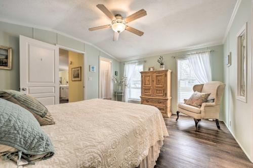 een slaapkamer met een bed en een plafondventilator bij Charming South Haven Home - Great Location! in South Haven