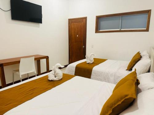 Postel nebo postele na pokoji v ubytování Hotel Overland