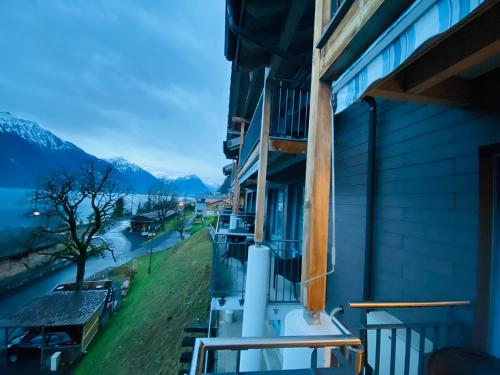 a balcony of a building with a view of a river at Lake View Residence in Niederried
