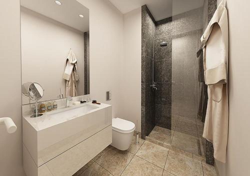 a bathroom with a toilet and a sink and a shower at Prime Istanbul in Istanbul