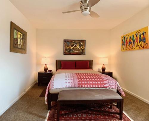 a bedroom with a bed and two night stands at Sunrise Springs 1-Bedroom with Balcony & Pool in Palm Springs