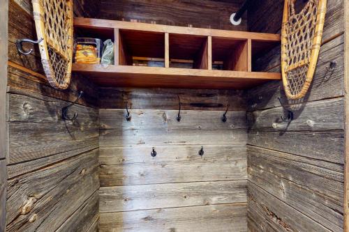 a room with wooden walls and wooden shelves at Mountainside 20 in Warren