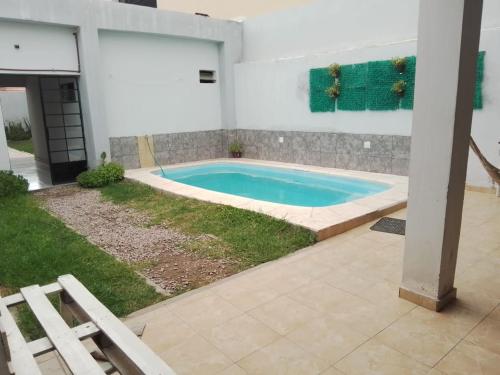 a swimming pool in the backyard of a house at La Comodoro in Santiago del Estero