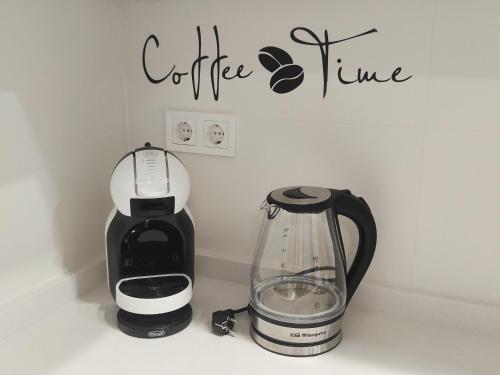 a coffee maker and a blender sitting on a counter at M&D Centro Málaga in Málaga