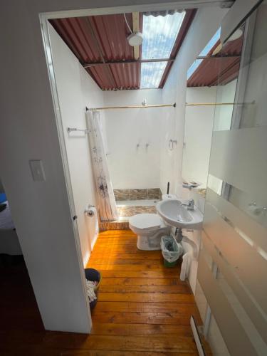 a bathroom with a toilet and a sink at Glamping en villa in Villa de Leyva