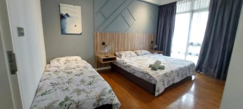 Vuode tai vuoteita majoituspaikassa Anggun Platinum Suites