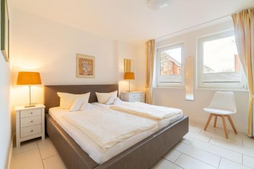 Ένα ή περισσότερα κρεβάτια σε δωμάτιο στο Nordland Appartements Wohnung Falster