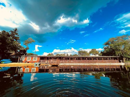 a bridge over a body of water with a blue sky at Olde Mill Inn of Clarkston in City in the Village of Clarkson