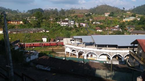 a view of a train station with a train at KPL Holiday Homes in Hatton