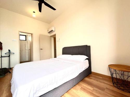 a bedroom with a large bed with a ceiling fan at Ins Suite @ The Quartz Residence-Infinity Pool in Melaka