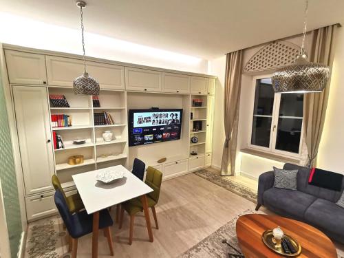 a living room with a couch and a table at Minderluk in Sarajevo