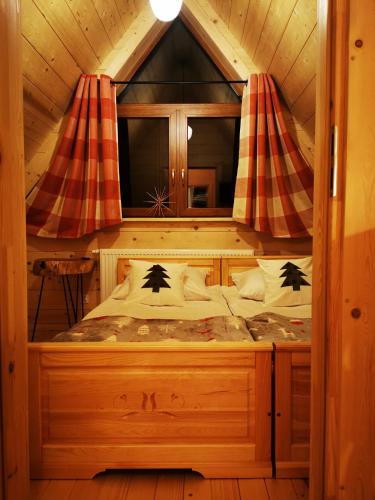 a bedroom with a bed in a tree house at Heidi in Zakopane
