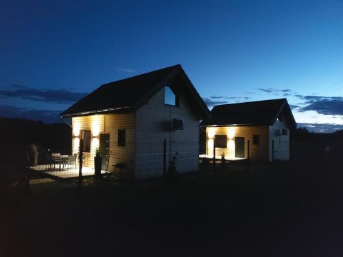 a house at night with its lights on at Ahoj Siemiany in Siemiany