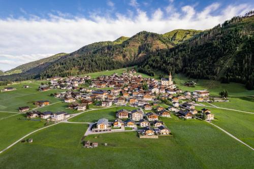 an aerial view of a village in the mountains at Apartment LENA in Obertilliach