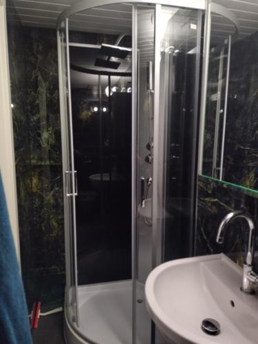 a bathroom with a shower and a sink at Spacieux studio 38m2 in Les Paccots