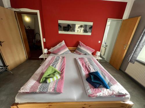 a bedroom with a bed with two pillows on it at Gästehaus Alpina in Berchtesgaden