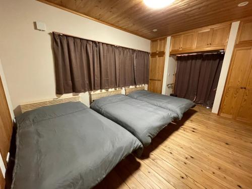 Postel nebo postele na pokoji v ubytování ARS Hotel Nikko Imaichi 一棟貸切