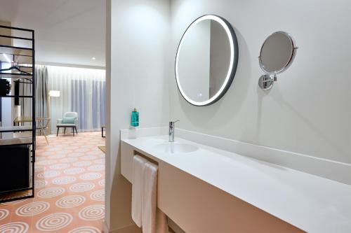 a bathroom with a sink and a mirror at Boutique Hotel Luna Granada Centro in Granada