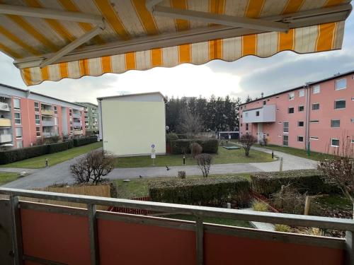 a large white billboard in a city with buildings at Apartment in einer ruhigen Umgebung in Graz in Graz