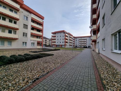 an empty street in a city with buildings at Apartment Banska - City Centre & Free Parking in Banská Bystrica